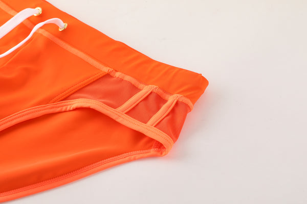 MCE X Shea Couleé orange swim briefs